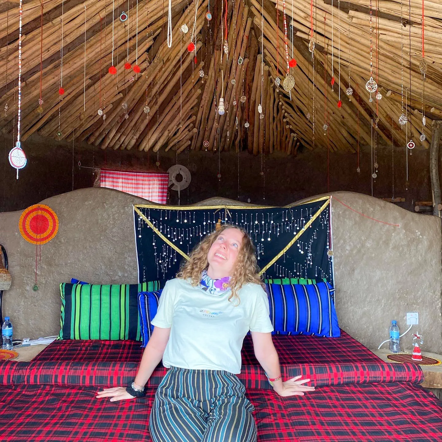Zara Charity volunteer assisting in a tent during a community event, supporting outreach and development initiatives in Tanzania.