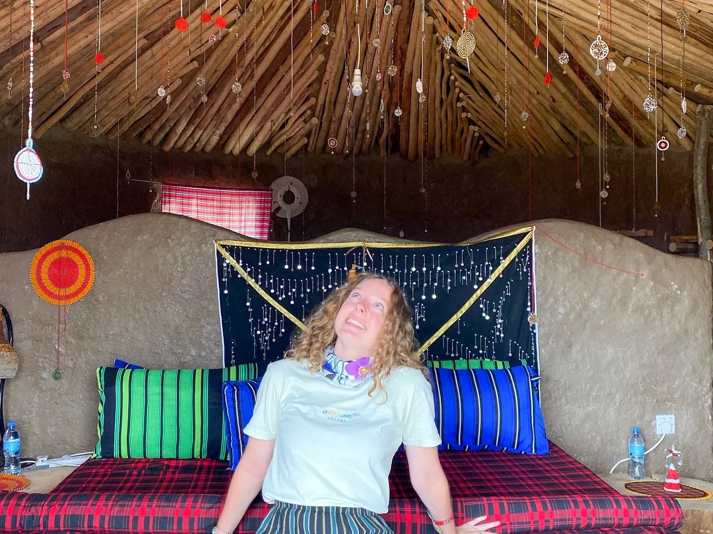 Zara Charity volunteer assisting in a tent during a community event, supporting outreach and development initiatives in Tanzania.